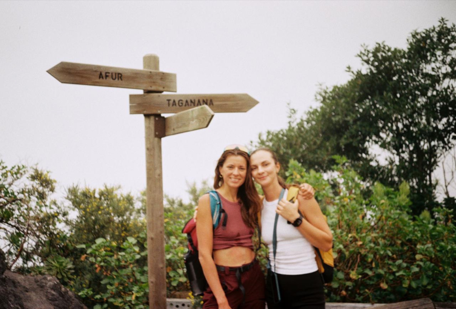 Canary.Hikes hikers next to the Afur and Taganana trail signs in Anaga
